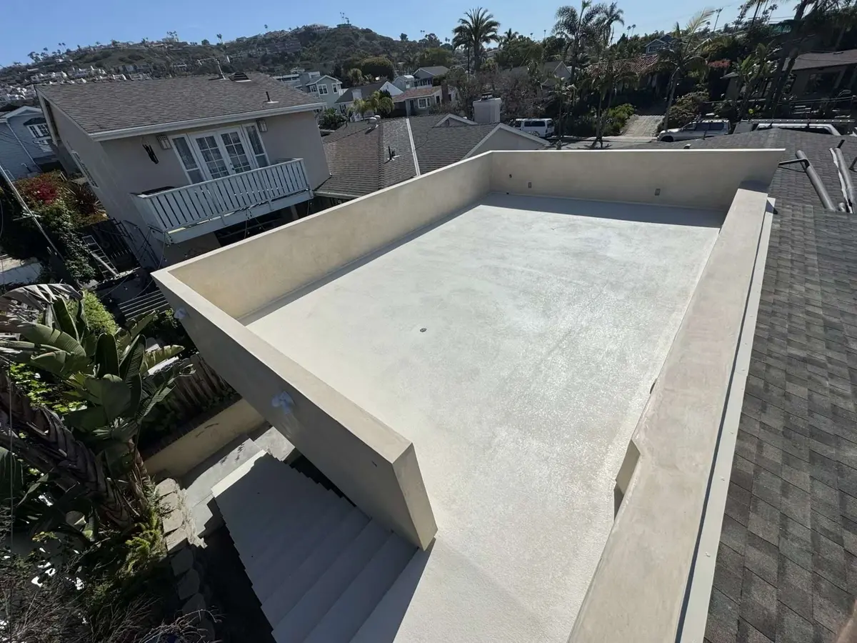 Liquid coatings waterproofing being applied on an elevated roof deck