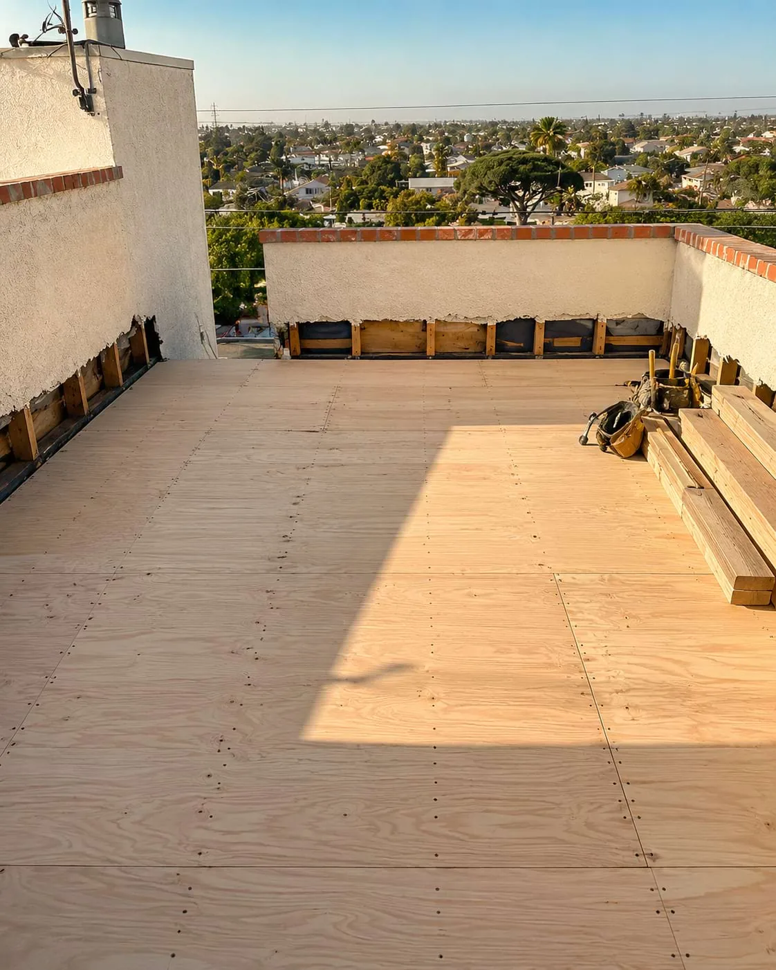 Rooftop plywood deck prepared for sealing and waterproofing