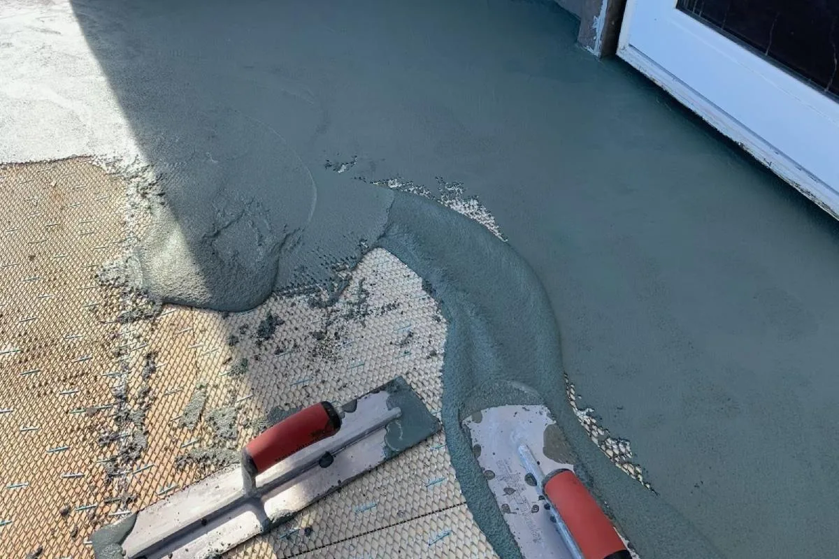 Repair structural cracks and damage before waterproofing.