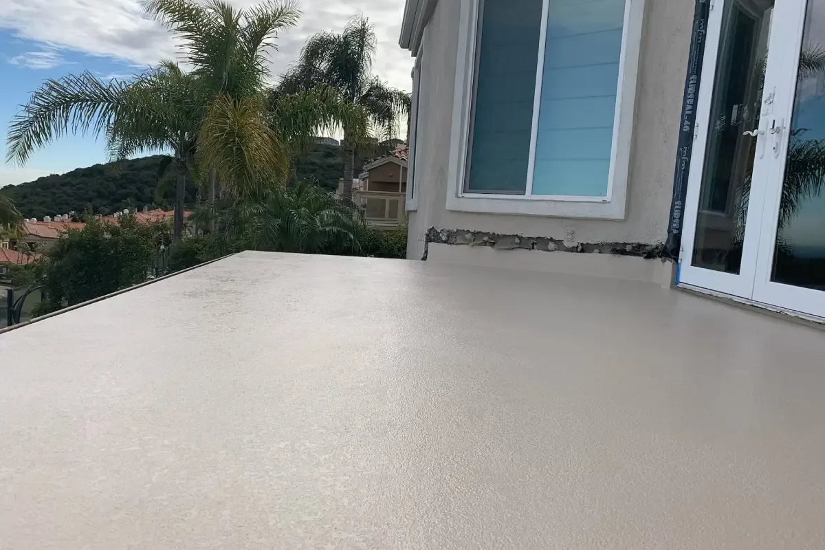 Finished deck coating surface that improves durability and outdoor living appeal