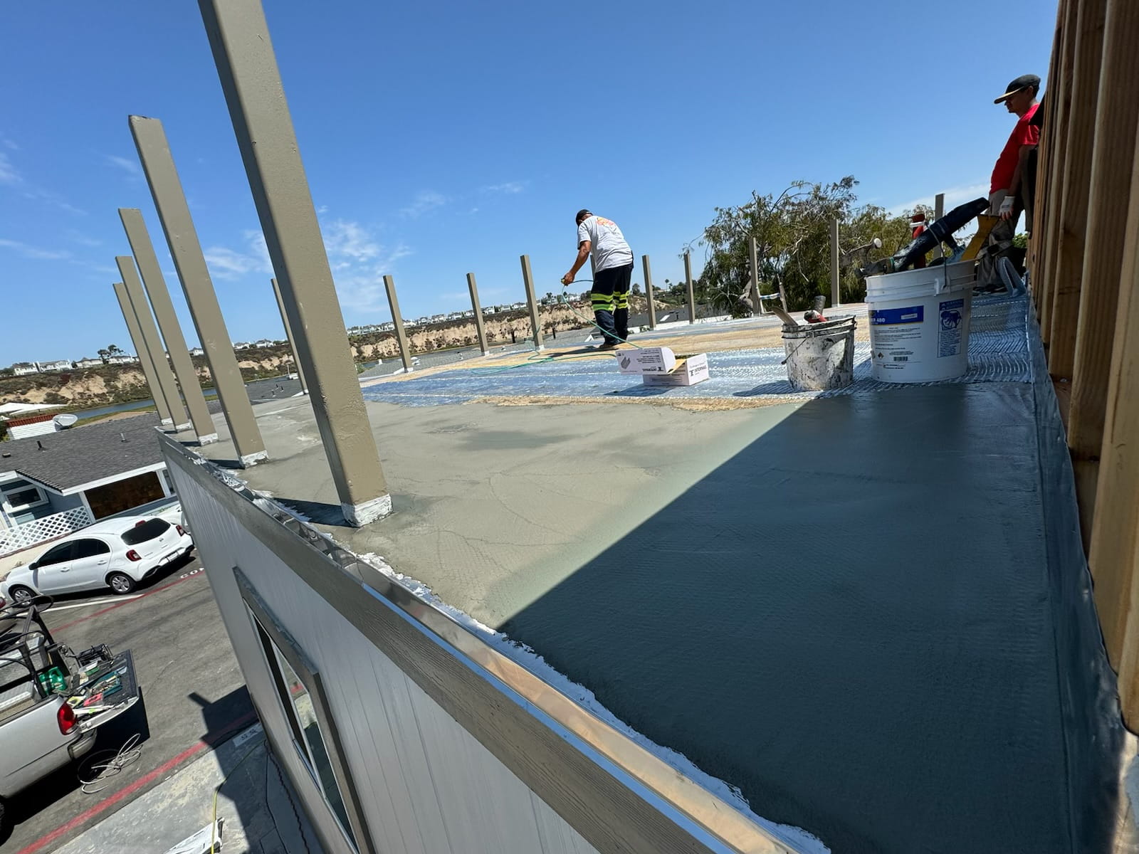 Safety decking installation in progress with waterproofing materials being applied
